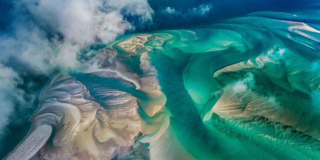 Aerial photograph of turquoise tidal sandbanks off the Mozambican coast taken from a charter helicopter