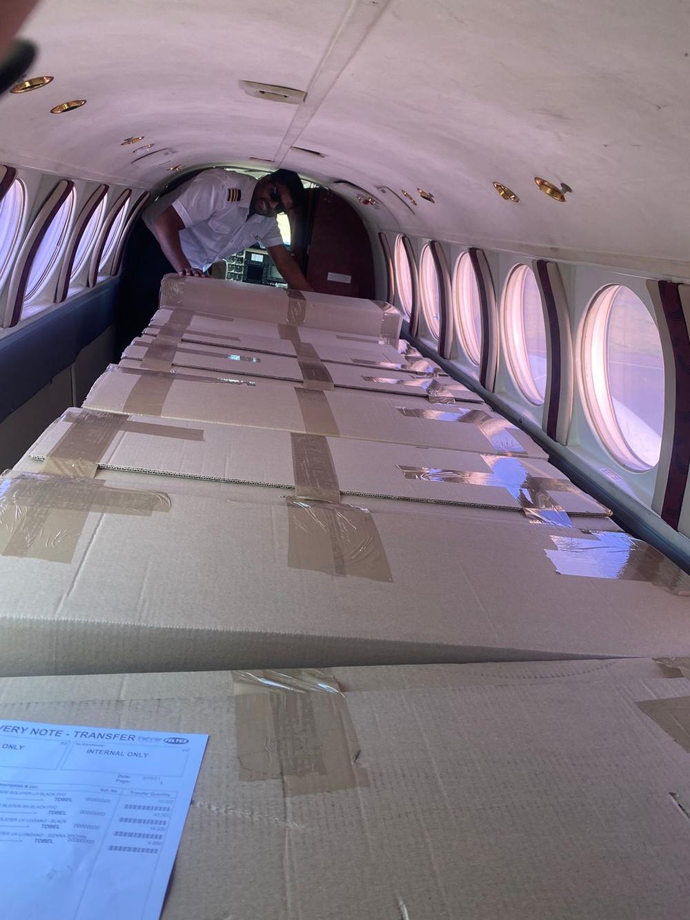 Cabin-load freight stacked and secured inside a King Air for an urgent parts delivery